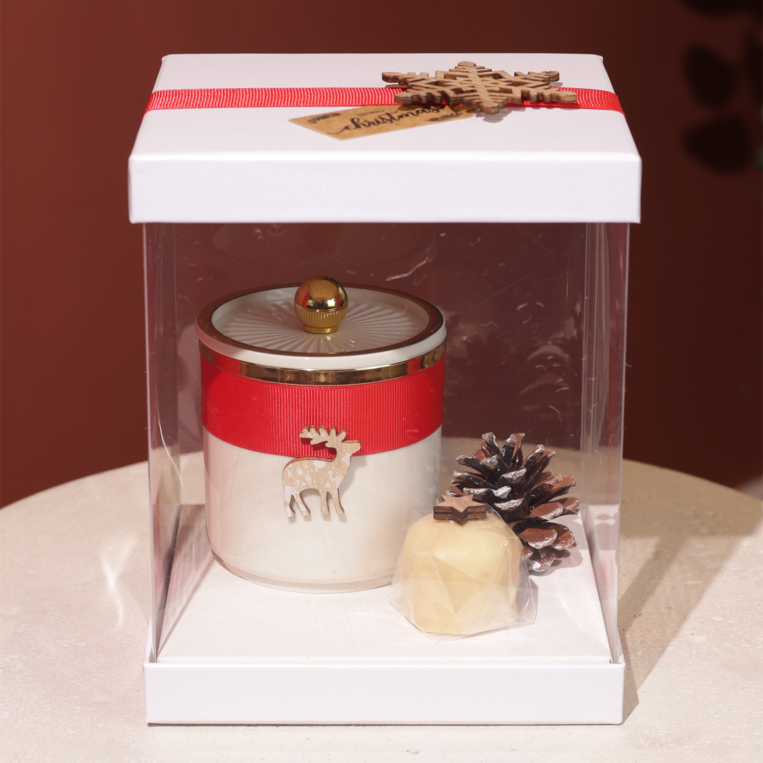 White box with beige jar